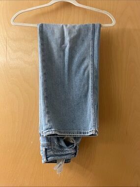Acne light blue denim jeans with contrast gold stitching